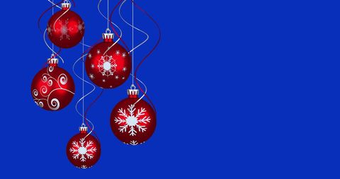 Red Christmas Ornaments Hanging Against Blue Background - Download Free Stock Images Pikwizard.com