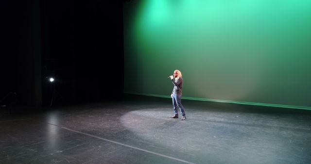 Solo Performer Singing on Stage Under Green Tint Light - Download Free Stock Images Pikwizard.com