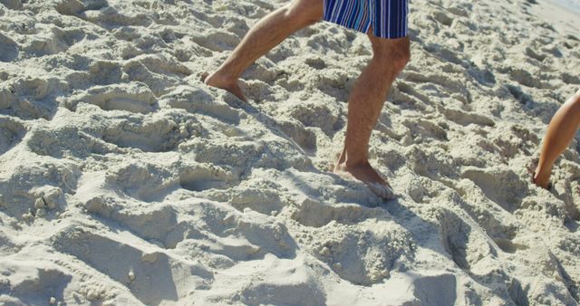 Man Walking on Sandy Beach in Summer - Download Free Stock Images Pikwizard.com