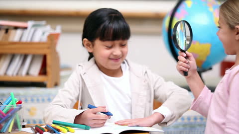 Curious Students Exploring with Magnifying Glass in Classroom