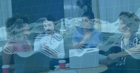 Collaborating team brainstorming around laptops in modern office lounge with analytics overlay