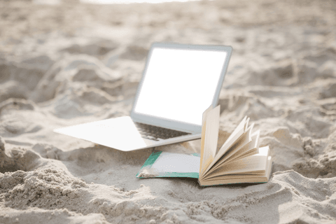 Transparent Laptop and Book on Sunny Beach Sand - Download Free Stock Videos Pikwizard.com