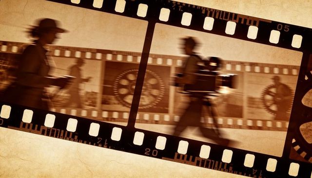 Carrying vintage film camera with filmstrip overlay, sepia retro cinema concept
