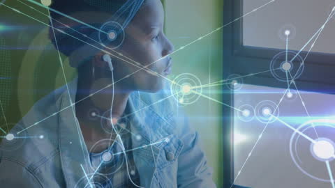 Thoughtful Student Wearing Headphones with Digital Connections