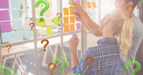 Team Collaboration with Colorful Sticky Notes and Question Marks