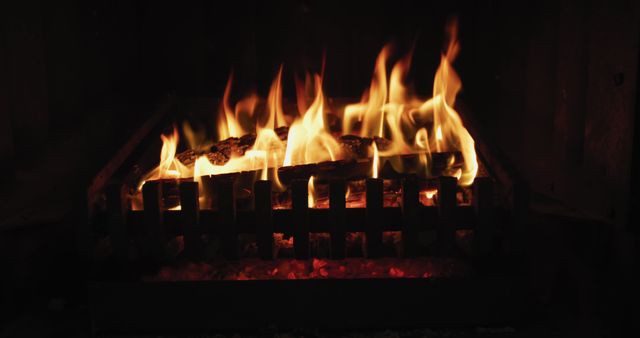 A cozy Christmas scene with logs ablaze in a home's sitting room fireplace. - Download Free Stock Photos Pikwizard.com