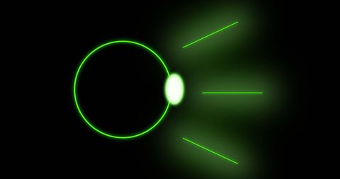 Glowing green circle with radiant lines on black background