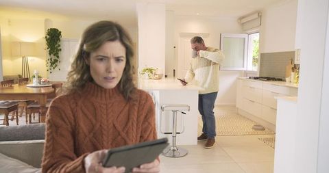 Contemporary Couple Connected by Gadgets in Cozy Living Space