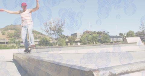 Caucasian man skateboarding with bubble overlay in skate park