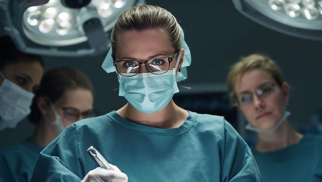 Skilled Surgeon Operating with Precision in High-Tech Surgical Room