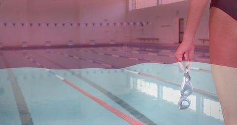 Female Swimmer in Front of Empty Indoor Pool with Superimposed Indonesian Flag Design