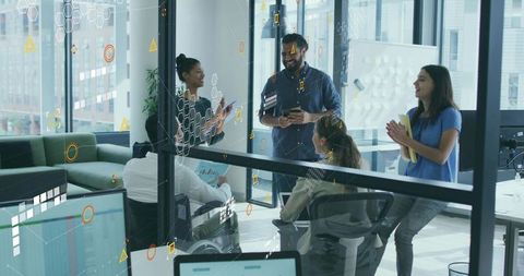 Creative Business Team Collaborating with Digital Technology in Modern Office