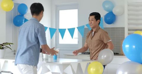 Man preparing for family gathering with colorful decorations