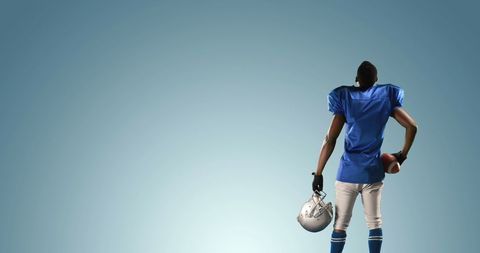 Athlete Holding Football Gear Contemplates Next Move