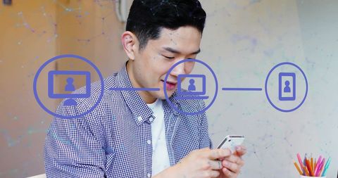 Asian Male Professional Connecting on Smartphone with Digital Network Symbols