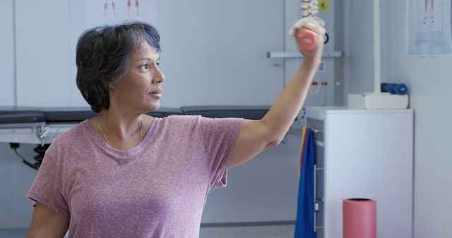 Senior Woman Doing Shoulder Rehabilitation Exercises with Trainer - Download Free Stock Images Pikwizard.com