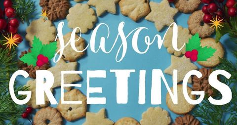 Season greetings holiday cookie wreath on blue backdrop with festive calligraphy