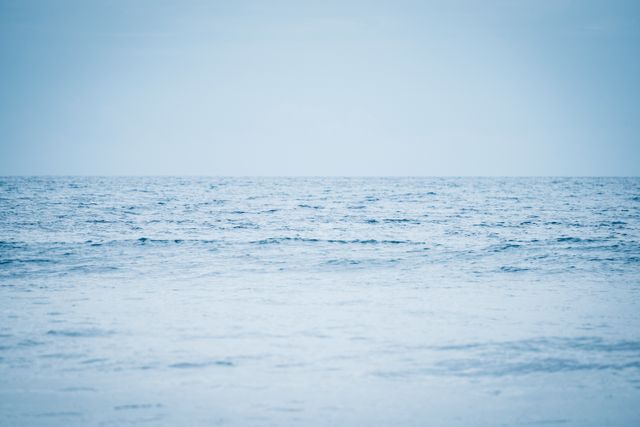 Tranquil Blue Ocean with Overcast Sky Horizon - Download Free Stock Photos Pikwizard.com