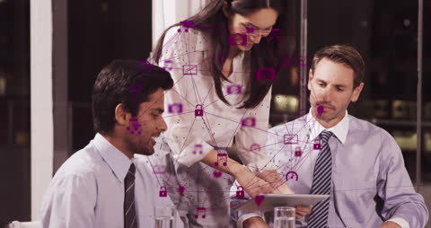 Diverse Team Engaged with Digital Network in Modern Office