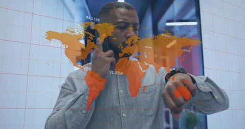 Manager Interacting with Digital World Map Dashboard for Real-Time Global Data Monitoring