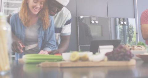 Couple Preparing Meal in Modern Kitchen with Holiday Vibe