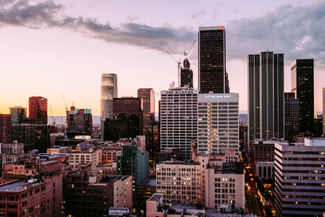 Downtown Skyline at Sunset with High-Rise Buildings and Clouds - Download Free Stock Images Pikwizard.com