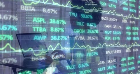 Businesswoman analyzing stock data in modern workspace