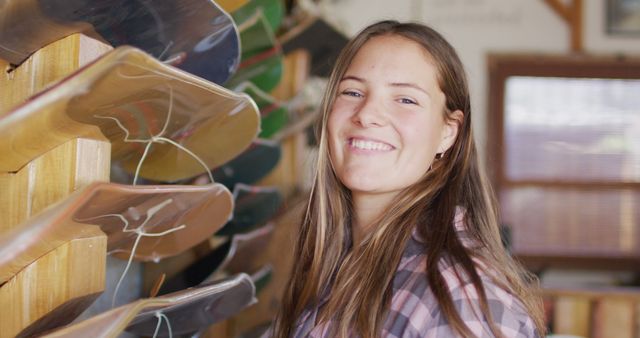 Smiling Young Woman in Skateboard Workshop - Download Free Stock Images Pikwizard.com