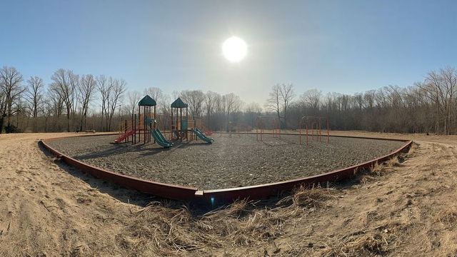 Serene single playground on sunny winter's day