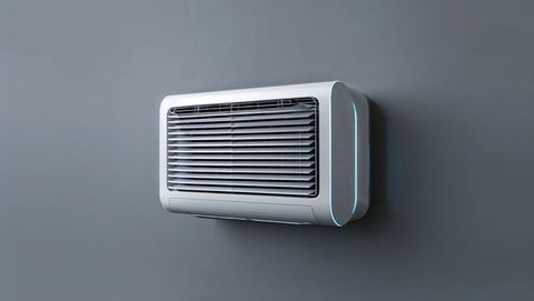 Sleek modern air conditioning unit with blue led lights on gray wall