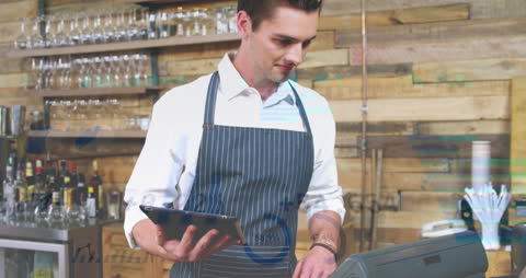 Barista Using Tablet with Digital Technology Integration