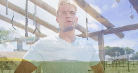 Athlete Gazzing Under Gymnastic Rig in Outdoor Fitness Park