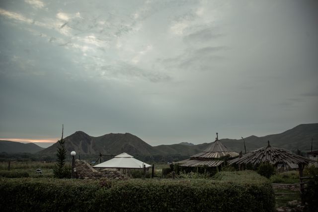 Rustic Tents and Wild Landscape During Overcast Sunset - Download Free Stock Photos Pikwizard.com