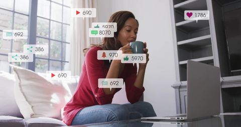 Woman Enjoying Coffee While Engaged with Social Media Notifications