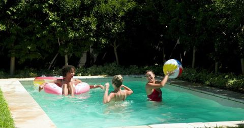 Diverse Female Friends Enjoying Summer Pool Activities