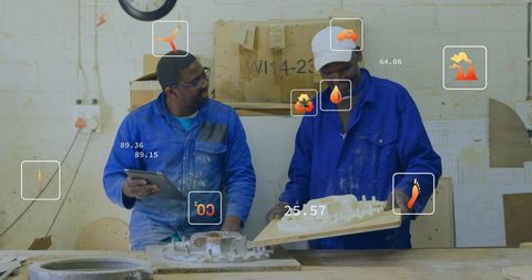 Workshop technicians inspecting plaster molds with tablet and augmented reality overlays
