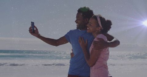 Smiling Couple Taking Selfie on Sunny Beach Embracing Serenity