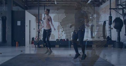 Women jumping rope in industrial boxing gym with halftone globe overlay for fitness