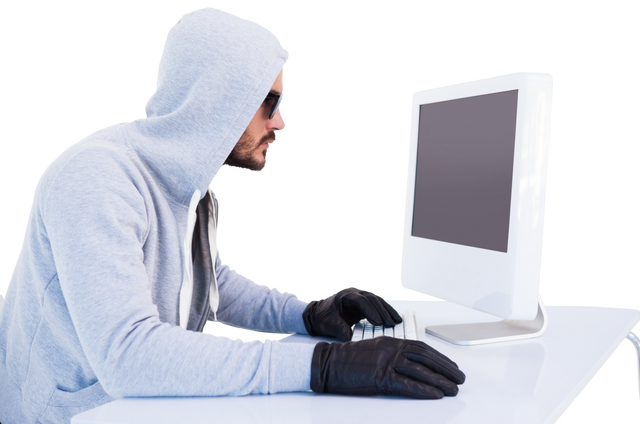 Caucasian Burglar in Hood and Gloves Using Computer Transparent Background - Download Free Stock Videos Pikwizard.com