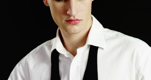 Portrait of Young Man in White Shirt with Black Tie Partially Removed - Download Free Stock Images Pikwizard.com