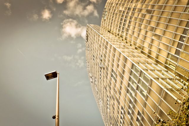 Low Angle View of Modern Glass Building at Sunset - Download Free Stock Photos Pikwizard.com