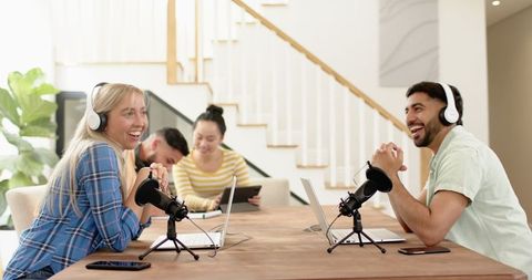 Diverse team podcasting in modern studio setting