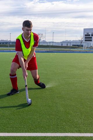 Male Hockey Player Practicing on Artificial Turf Field