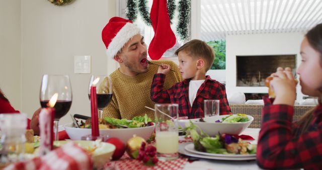 Family Celebrating Christmas Dinner Together in Festive Atmosphere - Download Free Stock Images Pikwizard.com