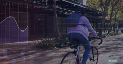 Woman biking in city conveying harmony of urban transportation and technology