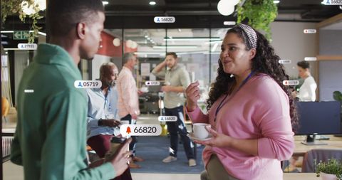 Diverse People Engaging with Social Media Data in Modern Office