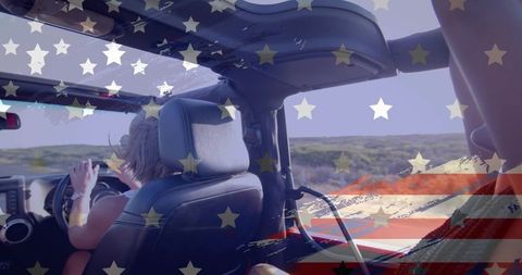 Woman driving open-top jeep on coastal dunes with american flag graphic overlay