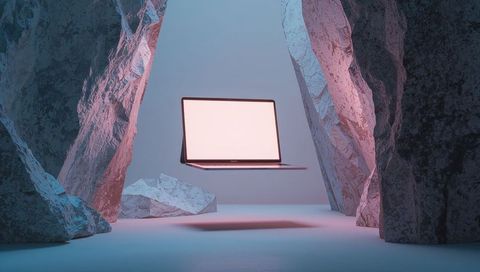 Futuristic floating laptop in minimalist cave setting