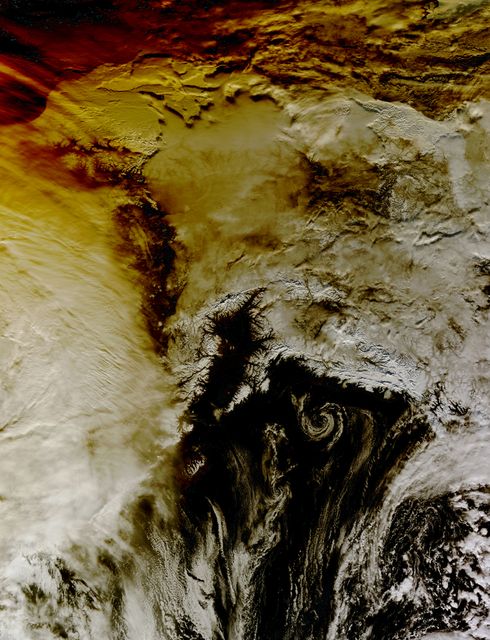 This image shows how the partial solar eclipse darkened clouds over Alaska. It was taken on Oct. 23 at 21:10 UTC (5:10 p.m. EDT) by the Moderate Resolution Imaging Spectroradiometer instrument that flies aboard NASA's Aqua satellite.    Credit: NASA Goddard MODIS Rapid Response Team  <b><a href="http://www.nasa.gov/audience/formedia/features/MP_Photo_Guidelines.html" rel="nofollow">NASA image use policy.</a></b>  <b><a href="http://www.nasa.gov/centers/goddard/home/index.html" rel="nofollow">NASA Goddard Space Flight Center</a></b> enables NASA’s mission through four scientific endeavors: Earth Science, Heliophysics, Solar System Exploration, and Astrophysics. Goddard plays a leading role in NASA’s accomplishments by contributing compelling scientific knowledge to advance the Agency’s mission. <b>Follow us on <a href="http://twitter.com/NASAGoddardPix" rel="nofollow">Twitter</a></b> <b>Like us on <a href="http://www.facebook.com/pages/Greenbelt-MD/NASA-Goddard/395013845897?ref=tsd" rel="nofollow">Facebook</a></b> <b>Find us on <a href="http://instagram.com/nasagoddard?vm=grid" rel="nofollow">Instagram</a></b>
