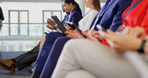 Business Professionals Using Tablets at Seminar Event